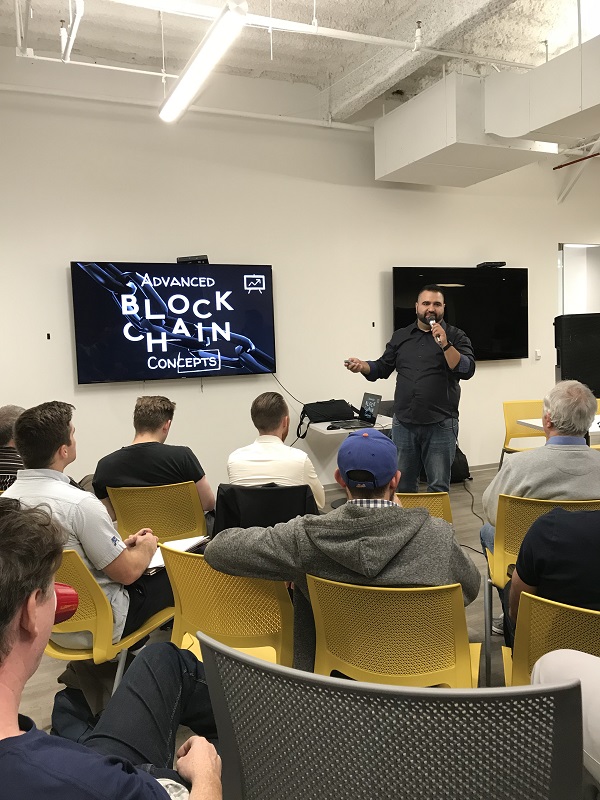 Joe Hernandez giving a talk on blockchain concepts